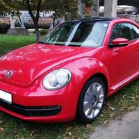 234 Volkswagen New Beetle красный