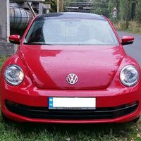 234 Volkswagen New Beetle красный
